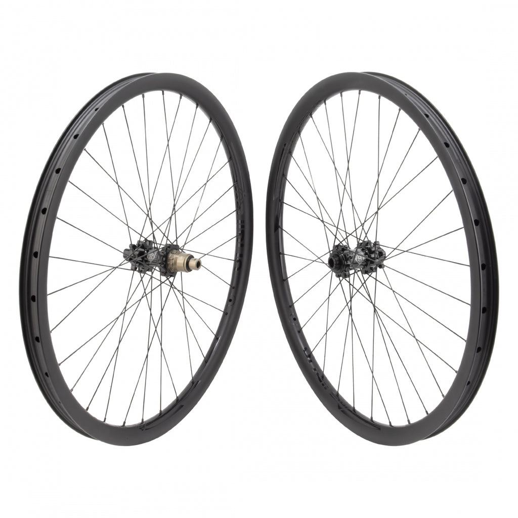 PAIR 27.5 584x27 ORIGIN 8 BOLT CARBON 29mmTBLS DISC BLACK 32 ORIGIN 8 MT1110 ELITE 11sXD 6B 15mm 12mm SP SEAL BLACK 142mm SAPIM RACE 2.0/1.8 BLACK